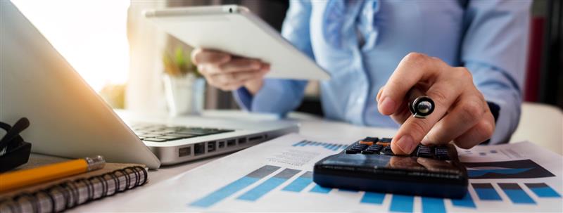 Business woman on laptop and phone